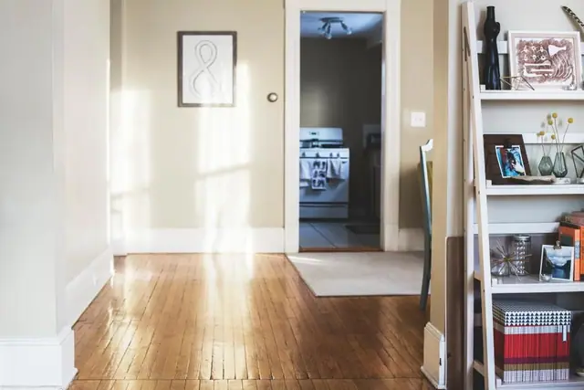 Sunlit hallway with wooden floor