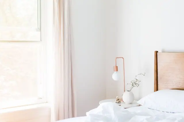 Calm white bedroom with morning light